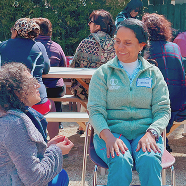 Volunteer practitioner providing acupuncture treatment at Botanical Bus Mobile Clinic.